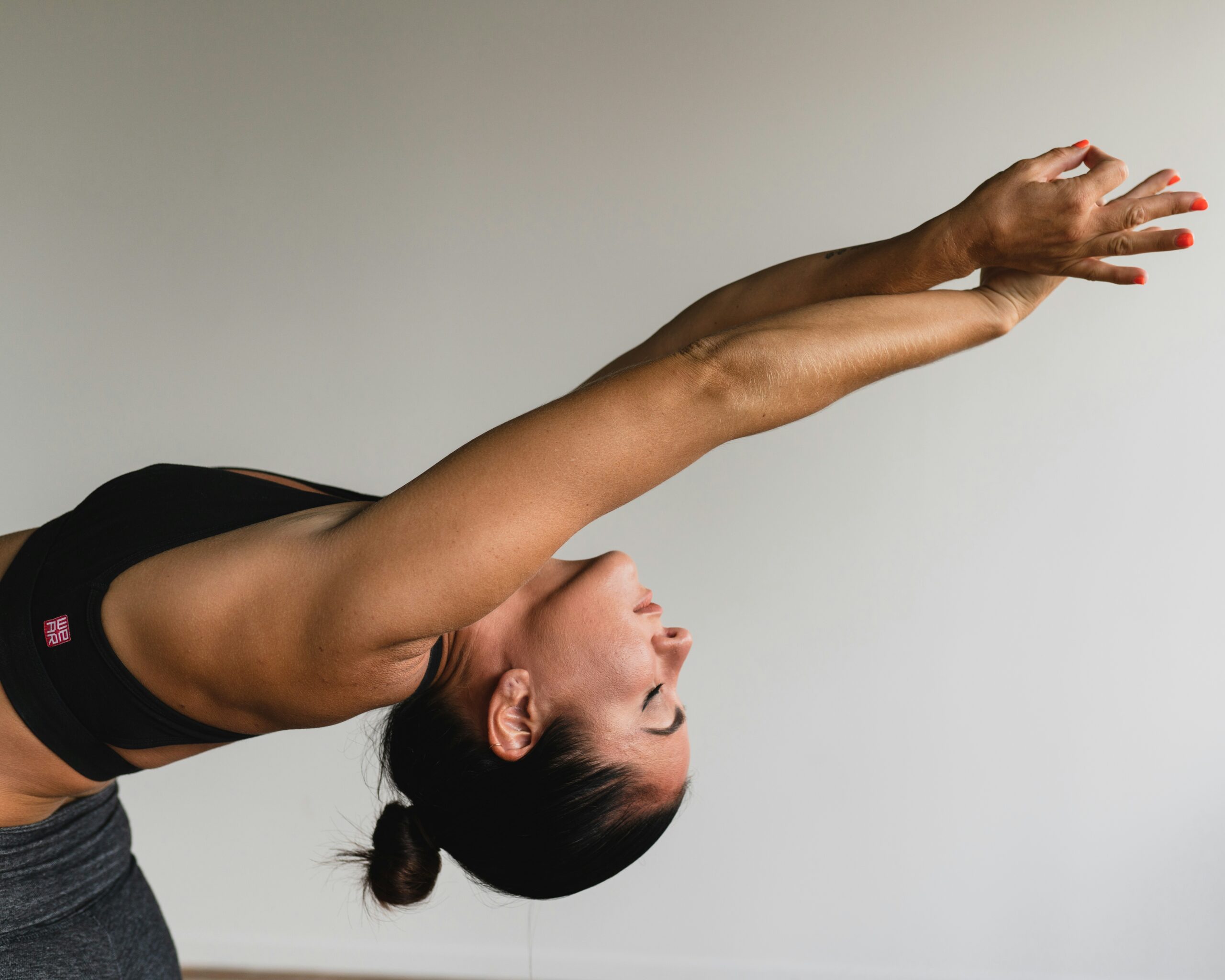 A person stretching calmly on a mat, representing gentle pelvic floor physical therapy for every body